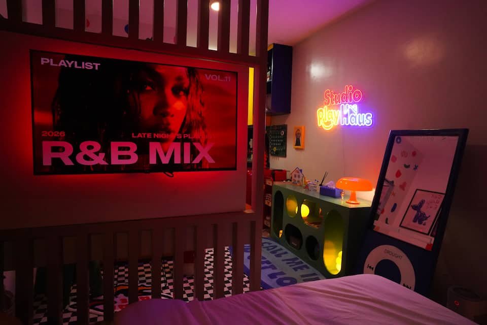 Bedroom side angle with R&B Mix TV and colorful honesty store snack stand